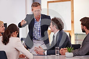 The only way is forward. a businessman addressing his colleagues during a meeting.