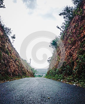 Way between Mountains and Cloudy Weather