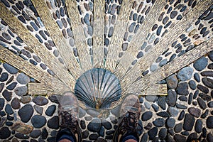 The way of saint James or compostelle . well worn Walking shoes with scallop shell.Nasbinals Lozere,France