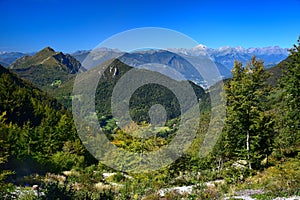 On the way to Monte Guglielmo. View to Corna Trentapassi and far to the Alps. Brescia, Lombardy, Italy