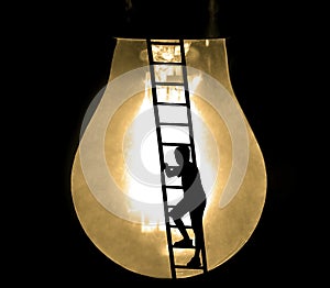 Way to success, education and creative grow idea concept with black silhouette of young male boy climbing ladder to big