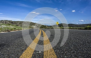 Low angle view of asphalt in the road of countryside, Serro, Minas Gerais, Brazil photo