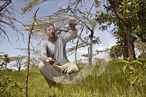 Wayne Pacelle CEO of Humane Society of United States checking snare trap for animals in Tsavo National Park, Kenya, Africa