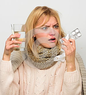 Ways to feel better fast. Headache and flu remedies. Get rid of flu. Woman wear warm scarf because illness or flu. Girl