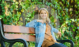 Ways to give yourself break and enjoy leisure. Girl sit bench relaxing fall nature background. Feeling free and relaxed