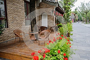 Wayside tables and chairs before Chinese traditional buildings
