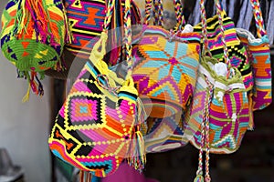 Wayuu handcrafted mochilas bags for sale in Guatape market, Colo