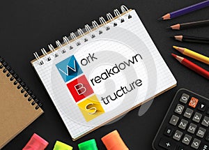 WBS - Work Breakdown Structure acronym on notepad, business concept background photo