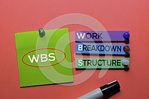 WBS. Work Breakdown Structure acronym on sticky notes. Office desk background photo