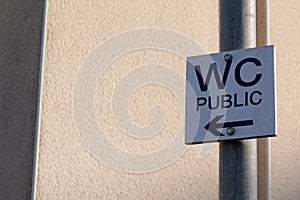 Wc arrow street text means Toilets public restroom sign panel access