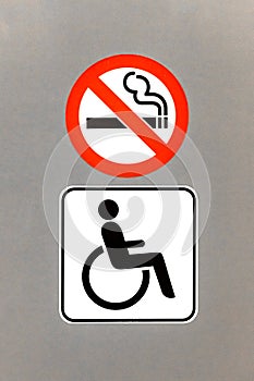 WC sign for disabled and not allowed smoking