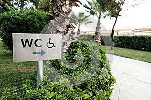 WC sign to a toilet room or washroom or bathroom or restroom including service for invalids or disabled people. Beautiful green