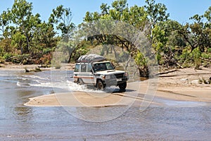4WD crossing a river photo