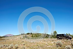 4WD vehicle driving through scenic mountains