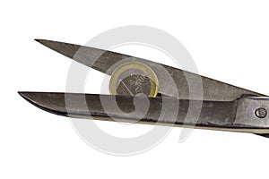 Weak Euro coin between scissors