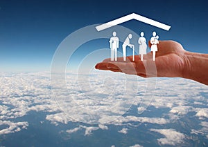 Weak social categories welfare concept with hand and roof on aerial sky view background