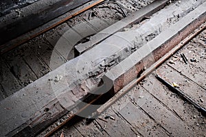 Weak wooden floor beam in old attic / loft with support construction