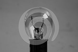 Weak yellow bulb light. small bulb black and white background