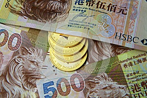 Wealth - Gold Coin and Hong Kong Dollar