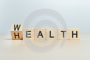 Wealth and health concept, word wealth to health on wooden cube blocks. growth investment future value success