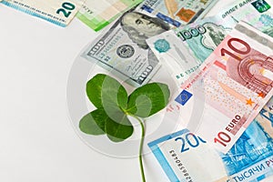 Wealth, success, business, lucky investment, win, jackpot concept. Lucky talisman. Saint patrick`s day. Money and shamrock. Four