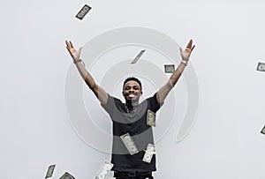 A wealthy African man throwing away his money