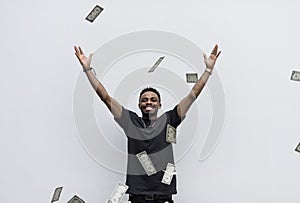 A wealthy African man throwing away his money photo