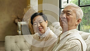 Wealthy Asian elderly couple happy in luxury house