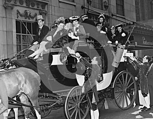 Wealthy group of people in horse drawn carriage