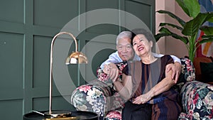 Wealthy rich lovely Asian old senior elderly couple in luxury home hold hand smile 4k