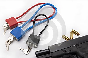 Weapon cable lock keys used to safely secure a firearm from being used , Gun safety and control concept
