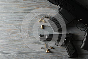 Weapon on gray wooden background