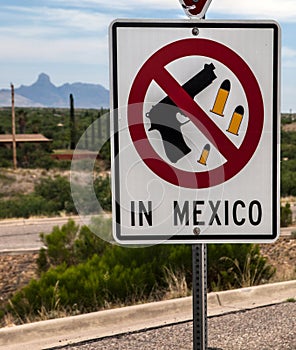 Weapon signpost on the US-Mexican border