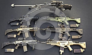 Weapons stash with automatic assault rifles and sniper rifle.