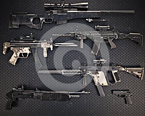 Weapons stash collection of assorted lethal firearms photo