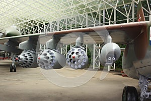 Weapons on the wing of an airplane.