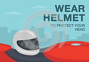 Wear helmet to protect your head warning. Side view of a white motorcycle helmet on a red bike seat.