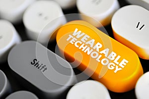 Wearable Technology is any technology that is designed to be used while worn, text concept button on keyboard