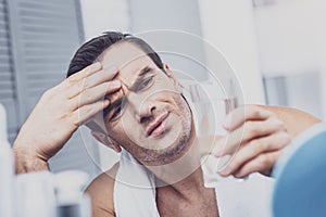 Wearied man having migraine