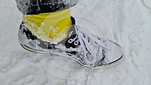 Wearing chucks in deep snow with yellow socks iced up!