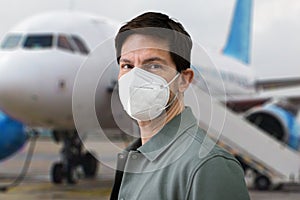 Wearing FFP2 Facemask In Airport. Plane Travel