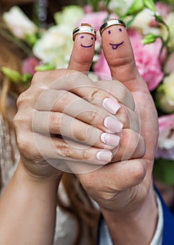 Wearing rings on his fingers which painted smiles