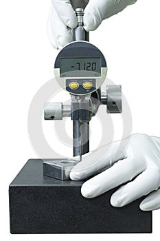 Wearing white glove use digital dial gauge measurement isolate