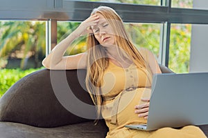 Weary pregnant woman, tired of working from home, navigates the challenges of balancing professional tasks with