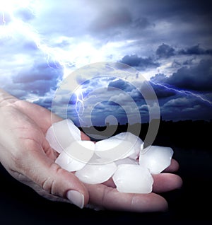 Weather anomaly hail in hand photo