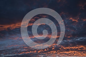 Weather background: Gathering cumulus clouds at sunset. Dramatic cloudy background. 3