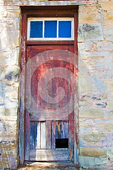 Weather beaten door of an old store room photo