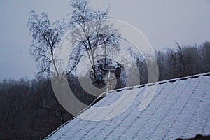 Weather instrument on a roof filled with snow