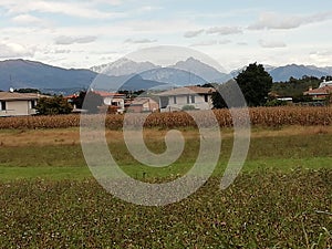 Weather over the alps  in  farmlands landscape  in italy photo