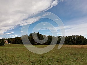 Weather sky and farmlands landscape  in italy